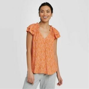 Orange floral blouse with ruffles